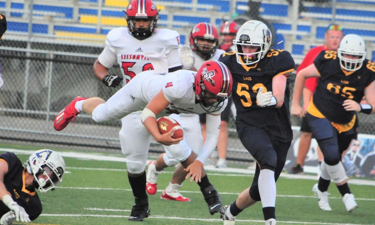 20210908-log-logan sissonville game LoganSiss Brody Thompson tackled Bryce Davis 52 tackle