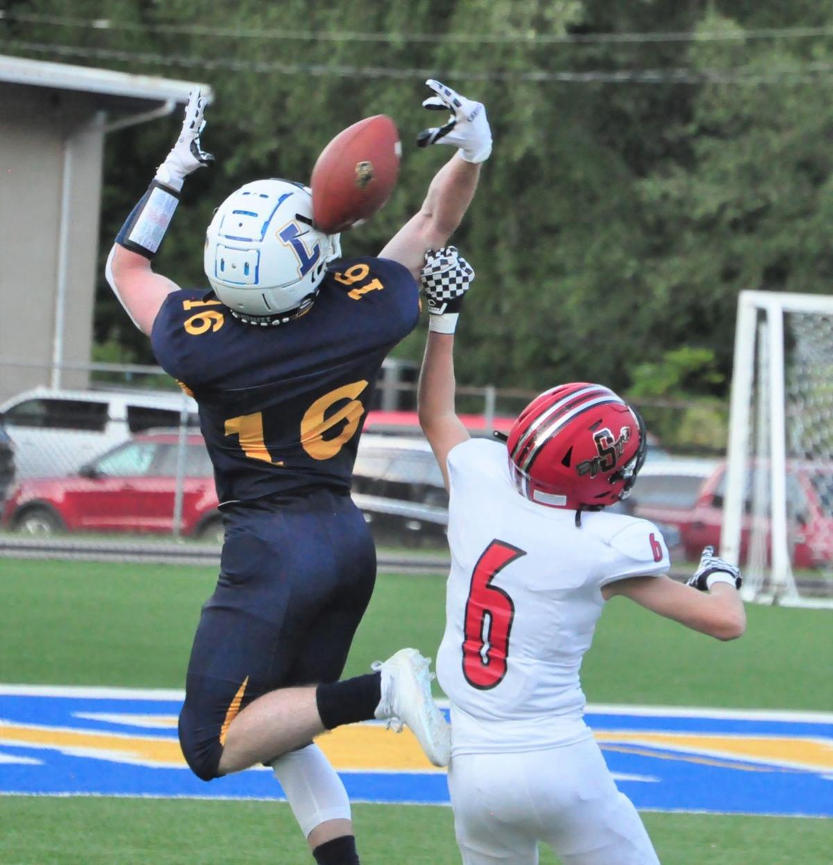 20210908-log-logan sissonville game Logan Siss Ethan Taylor intercepts pass from Dawson Maynard