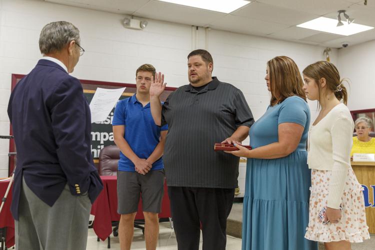 Board members take oaths; meeting times set News