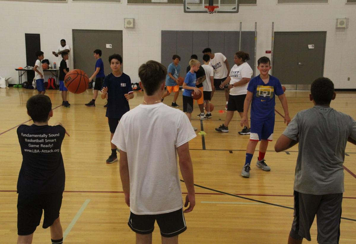 IN PHOTOS: Former NBA player Muresan hosts youth basketball clinic, Sports