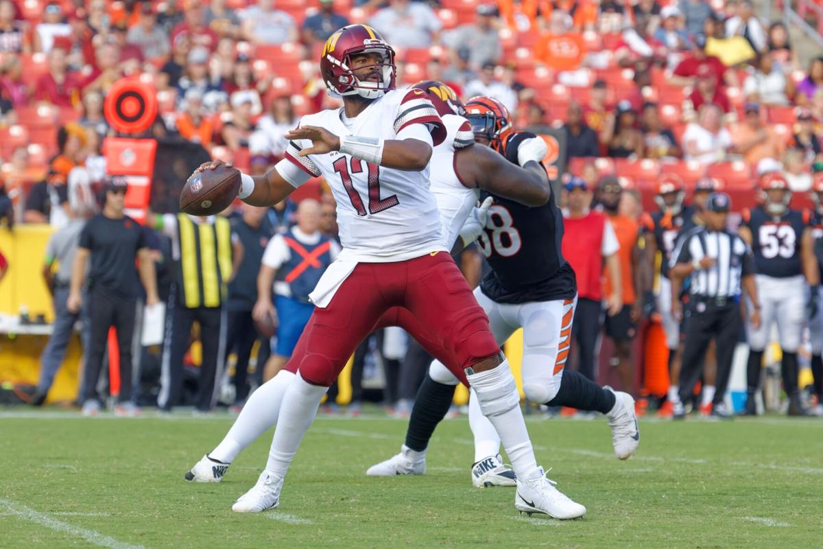 Washington Commanders wide receiver Mitchell Tinsley (86), left,  celebrating his touchdown against the Cincinnati Bengals with teammate  Marcus Kemp (19) and others during the first half of an NFL preseason  football game