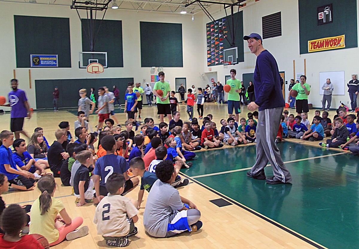 Former Nba Player Gheorghe Muresan Hosts Youth Basketball Clinic