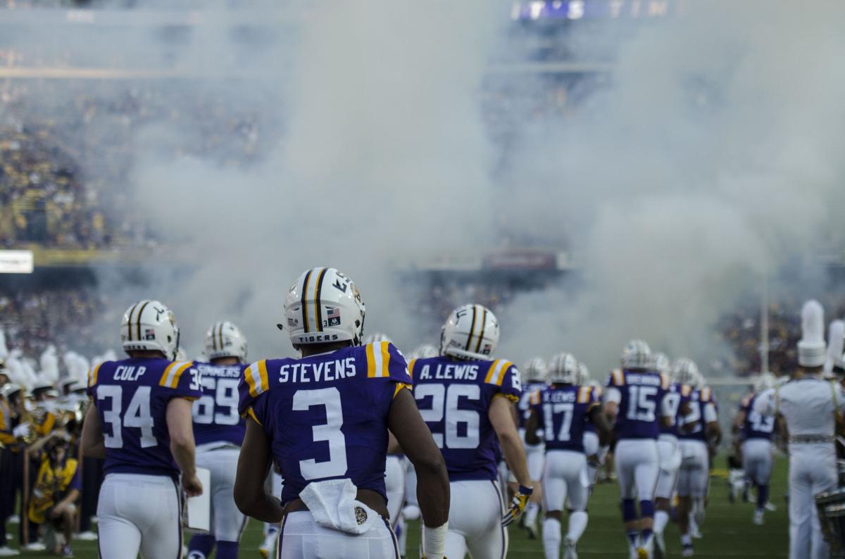 Why does the LSU football team wear white jerseys at home?
