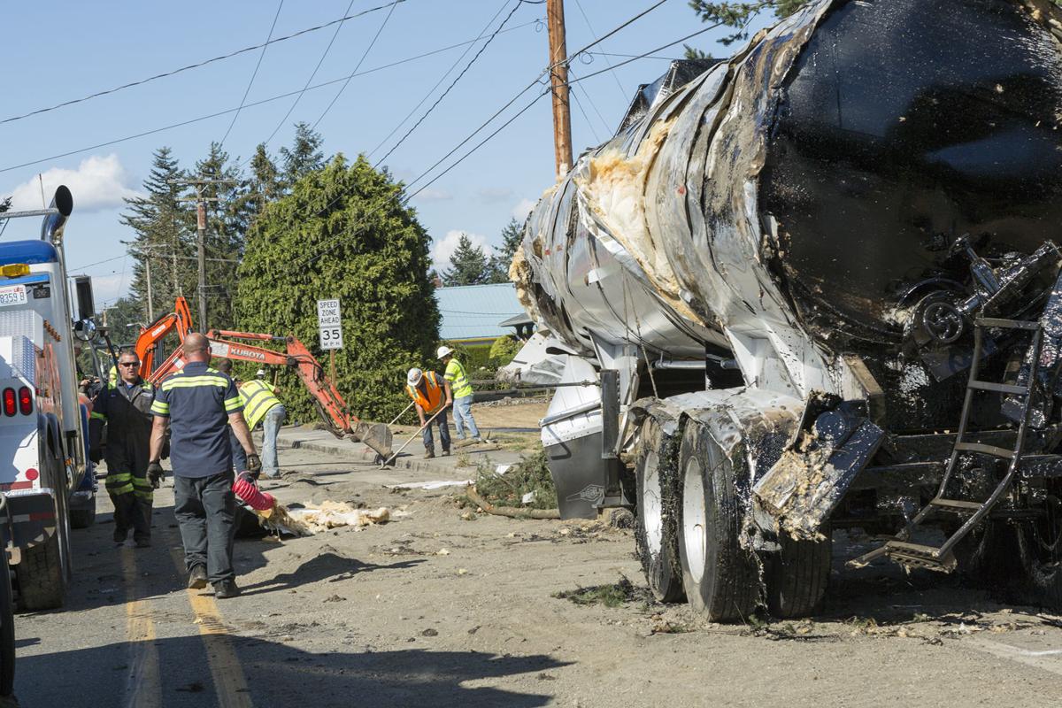 Truck spills asphalt load News