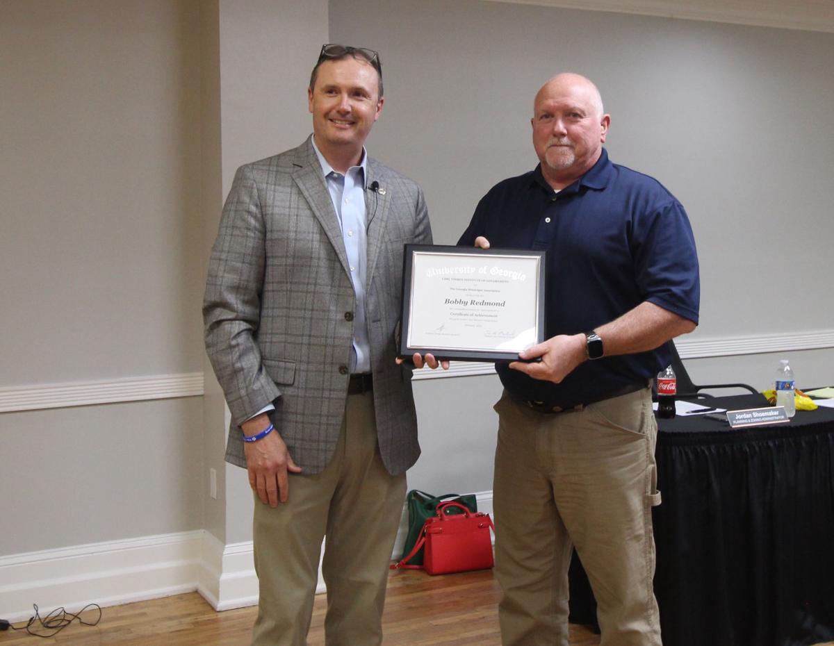 Redmon earns Certificate of Achievement
