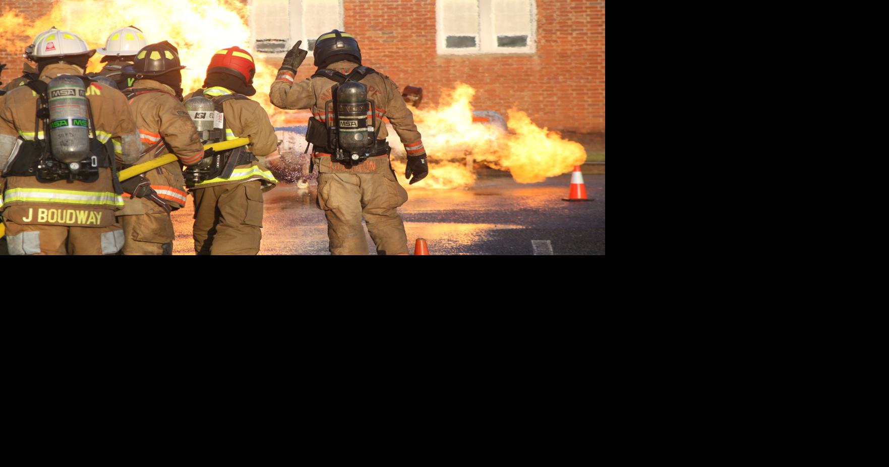 Volunteers train on pressurized container fire control Saturday ...