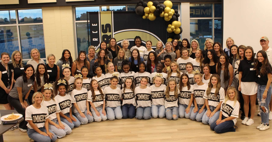 Commerce High School cheerleaders celebrate with program alumni