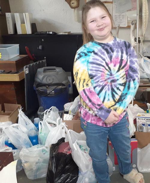 YOUNGSTER DONATES TO DOMESTIC VIOLENCE CENTER