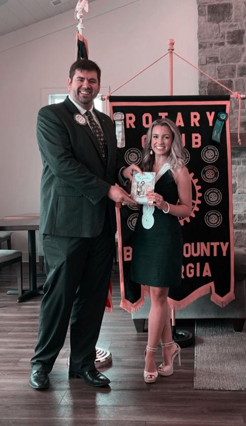 SPEAKS AT ROTARY MEETING