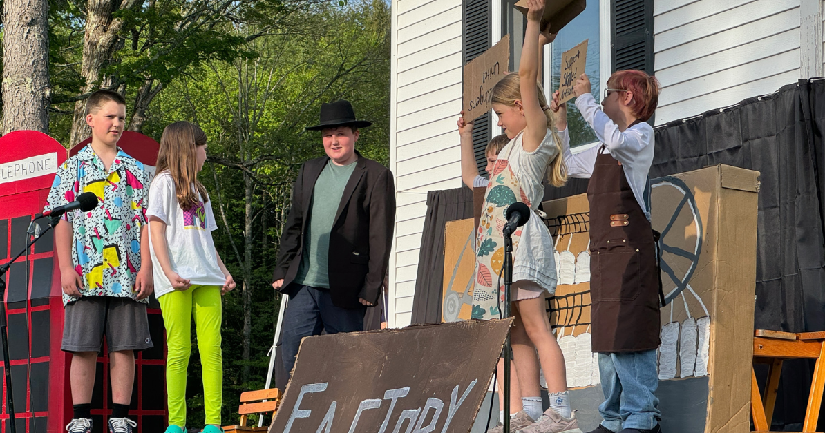Exploring eras of invention: Red Fox Community School students write and stage original time-travel play