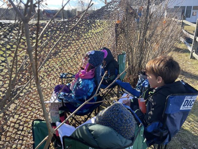 Mettawee birdwatchers settle into positions to make observations .jpg