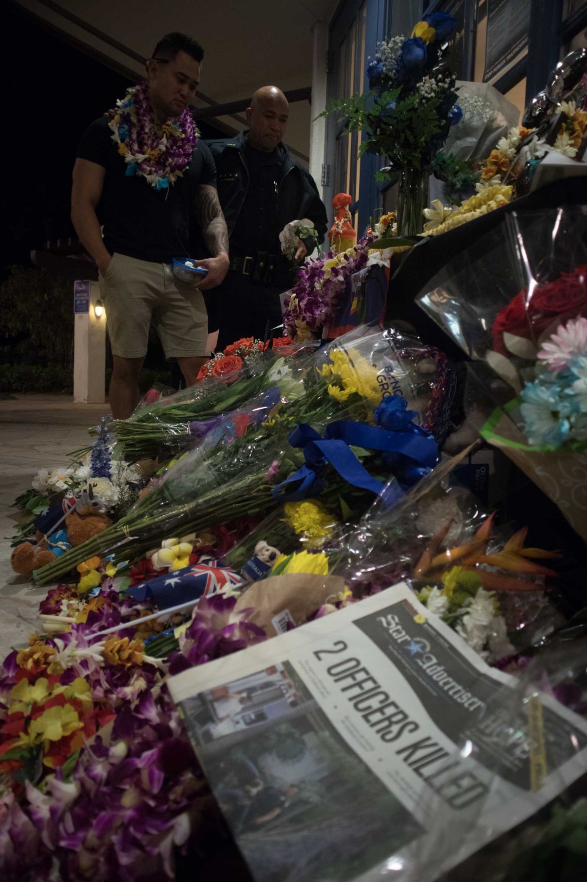 Jonathan Daniel Baba overlooking memorial for his girlfriend officer Tiffany Enriquez