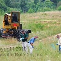 Worker finds woman's body in Ridgeway field