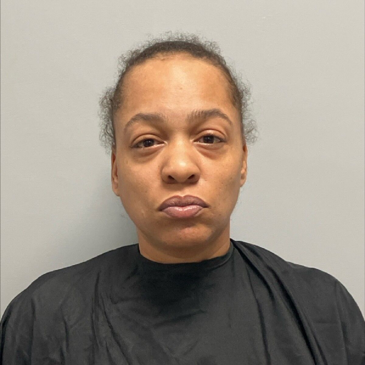 Woman arrested after shots fired at vehicle in Henry County