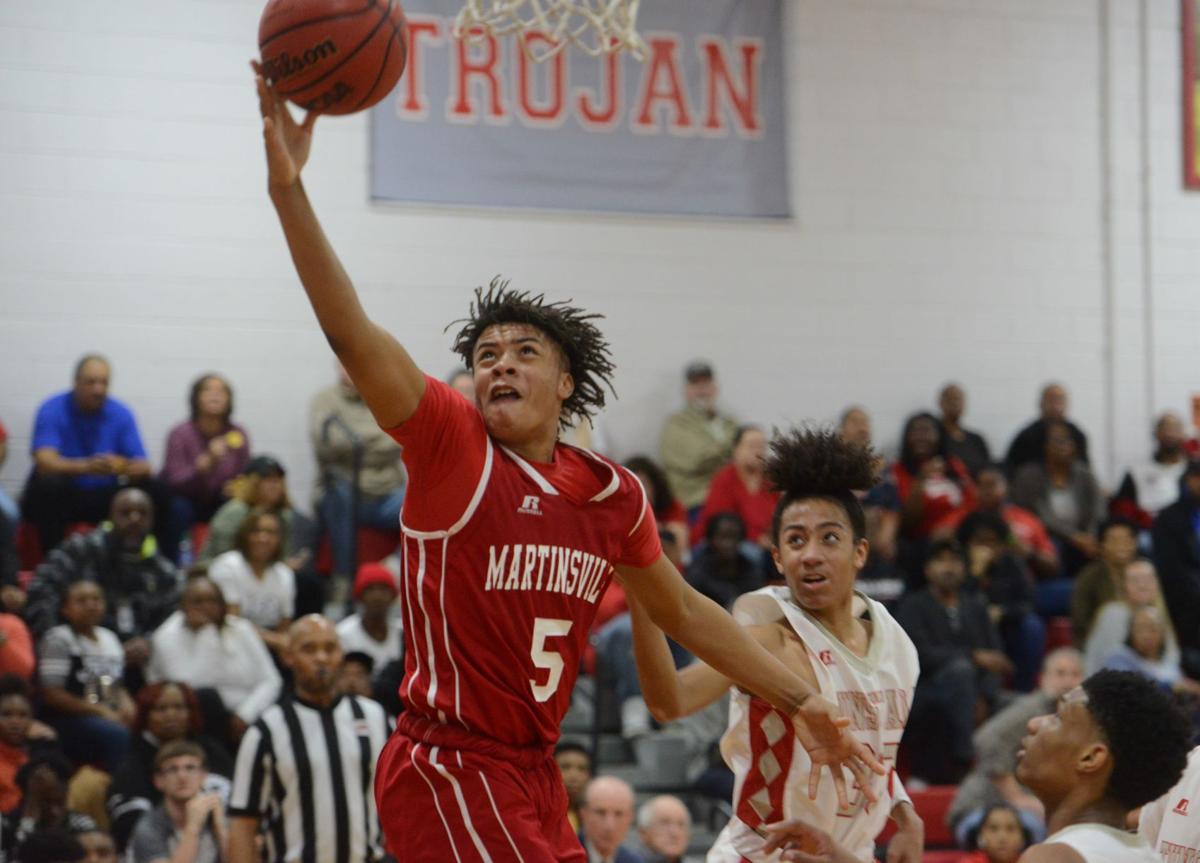 Bulldogs boys basketball topples Trojans to win seventh straight game