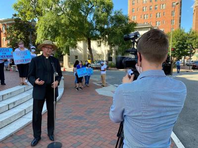 WATCH NOW: Father Mark White of Martinsville and his supporters hold vigil in Richmond outside Mass from which he was excluded