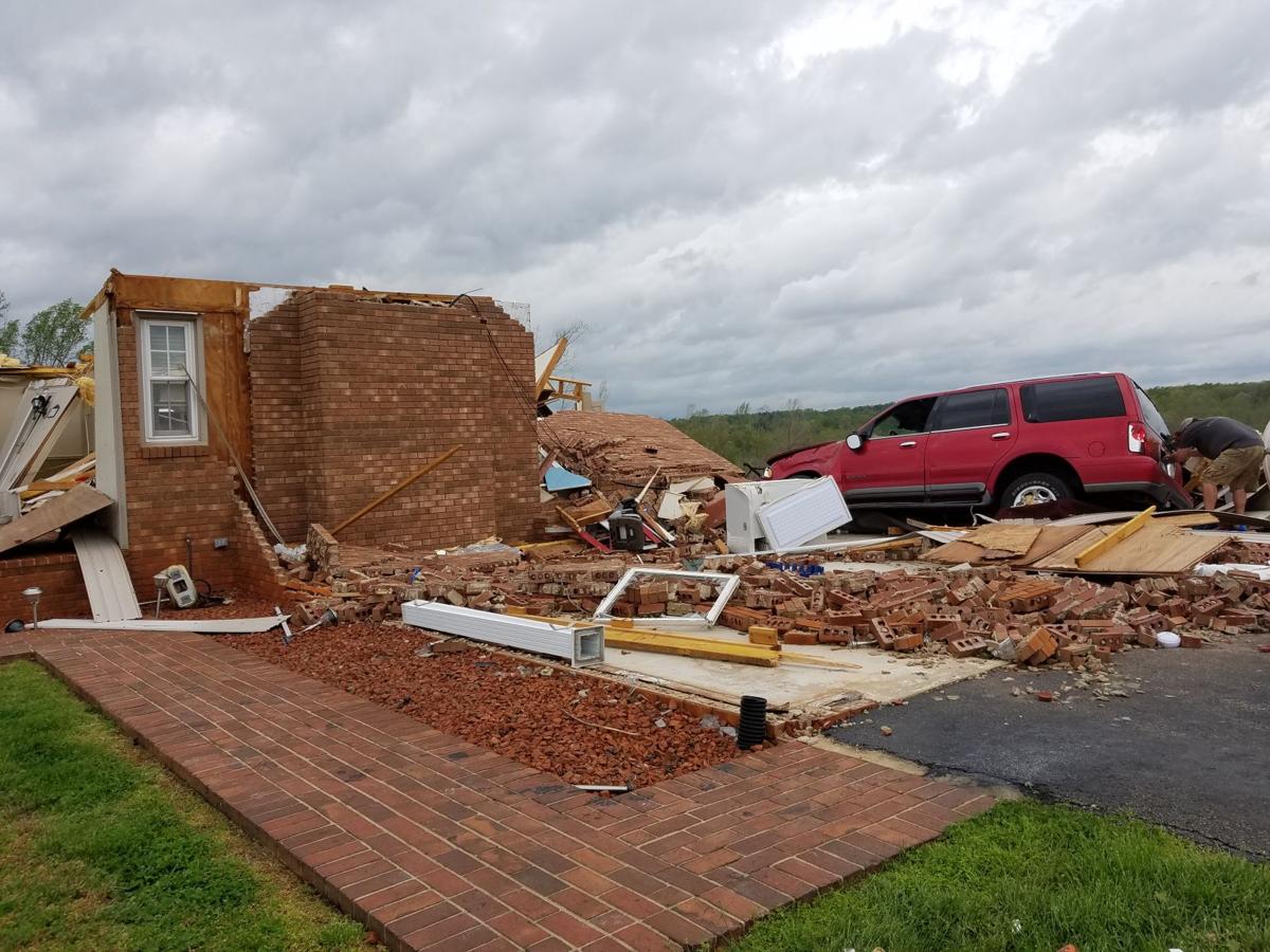 Apparent tornado destroyed homes as it cut a 5mile swath across