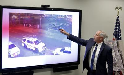 Scott Lang, Virginia Beach Chief deputy commonwealth attorney, explains footage from police worn body cameras during a press conference Tuesday on the fatal shooting of Donovon Lynch by a Virginia Beach police officer.