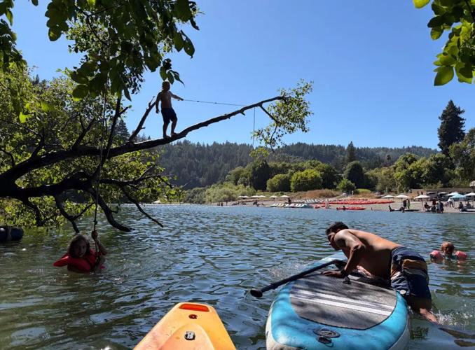 Families play in the Russian River near Johnson’s Beach.