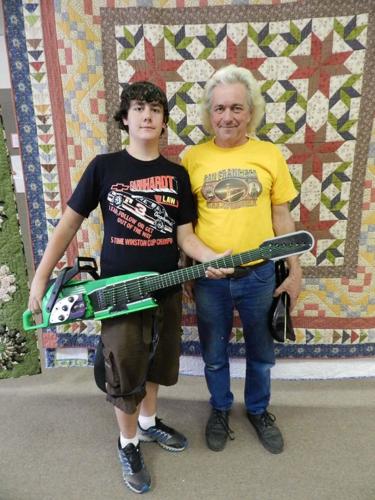 Father, son build unique chainsaw guitar