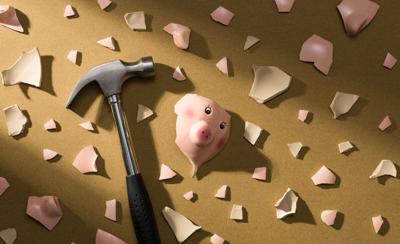 Broken piggy bank and shattered pieces