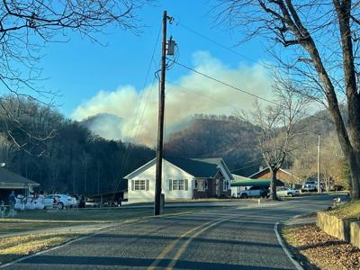 Firefighters seek to contain wildfire off Clear Creek Road
