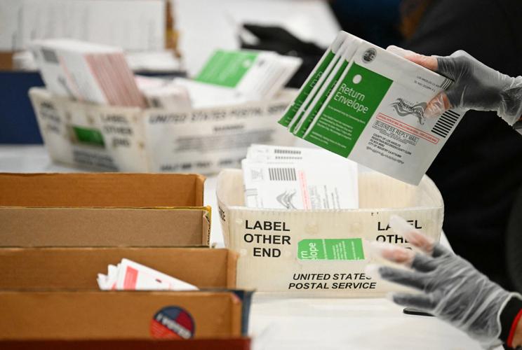Election workers process mail-in ballots at the Los Angeles County Ballot Processing Center during California's state primary election in the City of Industry, California, on June 2, 2026.
