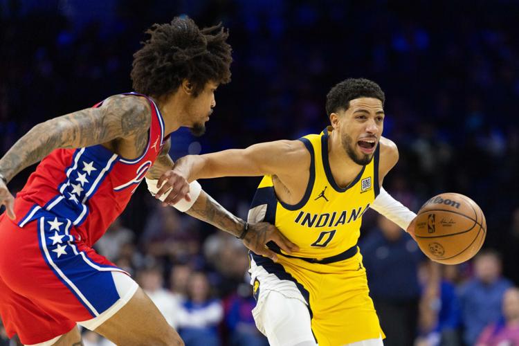 Dec 13, 2024; Philadelphia, Pennsylvania, USA; Indiana Pacers guard Tyrese Haliburton (0) controls the ball against Philadelphia 76ers guard Kelly Oubre Jr. (9) during the first quarter at Wells Fargo Center. Mandatory Credit: Bill Streicher-Imagn Images