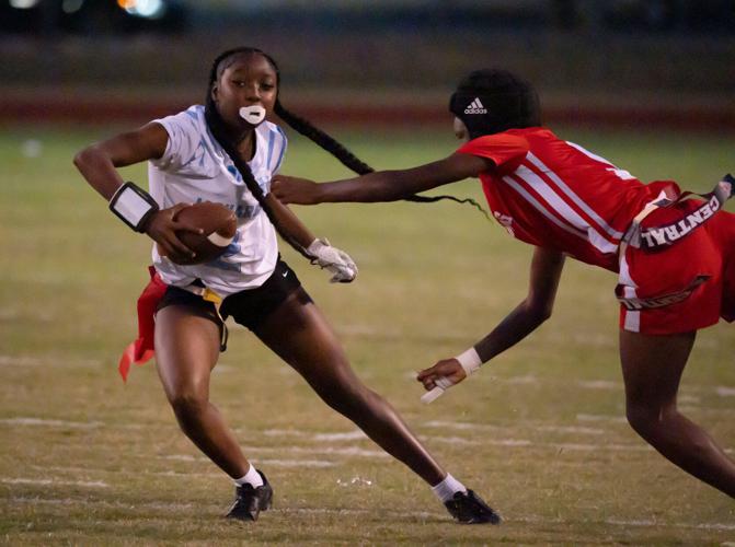 Oct. 2, 2025; Tuscaloosa, Alabama, USA; Northridge's Jiayiah Lee (2) tries to evade a flag pull by Central's Alaysha Merriweather (5) at Central High School.