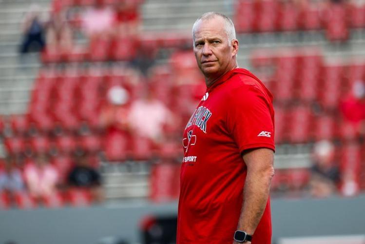 Sep 11, 2026; Raleigh, North Carolina, USA;  NC State Wolfpack head coach Dave Doeren looks on during the warmups of the game against Richmond Spiders at Carter-Finley Stadium.  Mandatory Credit: Jaylynn Nash-Imagn Images