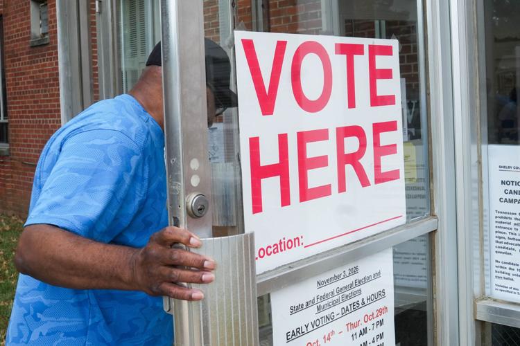 A voter walks into the polling place within Greater Middle Baptist Church on the first day of early voting in Memphis, Tenn., on
