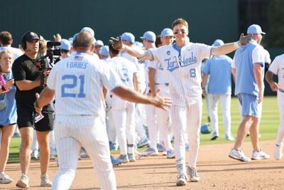 June 7, 2026; Chapel Hill, NC, USA; North Carolina Tar Heels outfielder Owen Hull (8) celebrates with head coach Scott Forbes after his game winning hit against the USC Trojans at Boshamer Stadium. Mandatory Credit: Zachary Taft-Imagn Images