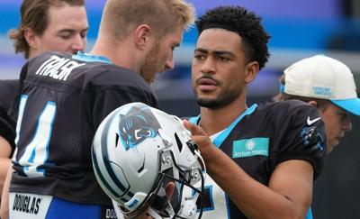 Aug 4, 2026; Charlotte, NC, USA; Quarterbacks quarterback Bryce Young (9), quarterback Kyle Trask (14) and quarterback Kenny Pickett (12) during training camp at Bank of America Stadium. Mandatory Credit: Jim Dedmon-Imagn Images