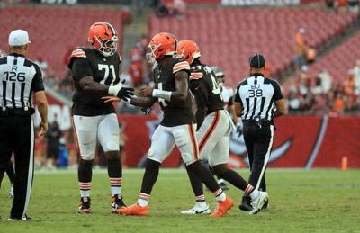 Sep 20, 2026; Tampa, Florida, USA;  Cleveland Browns quarterback Deshaun Watson (4) and offensive tackle Tytus Howard (71) celebrate as they beat the Tampa Bay Buccaneers  during the second half at Raymond James Stadium.  Mandatory Credit: Kim Klement N...