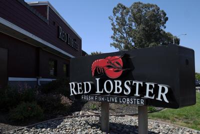 A sign is posted in front of a Red Lobster restaurant, announcing it's closure, on Tuesday, May 14, 2024, in Fremont, California.