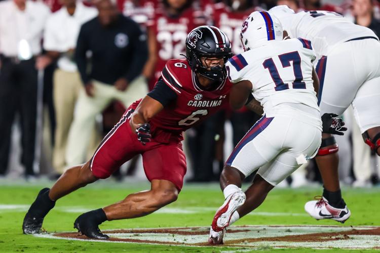 Sep 6, 2025; Columbia, South Carolina, USA; South Carolina Gamecocks linebacker Dylan Stewart (6) brings down South Carolina State Bulldogs running back KZ Adams (17) in the first quarter at Williams-Brice Stadium. Mandatory Credit: Jeff Blake-Imagn Images