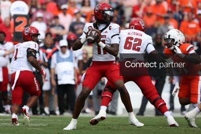 Aug 29, 2026; Charlottesville, Virginia, USA;  North Carolina State Wolfpack quarterback CJ Bailey (11) passes the ball during the first quarter against the Virginia Cavaliers at Scott Stadium.  Mandatory Credit: Greg Atkins-Imagn Images