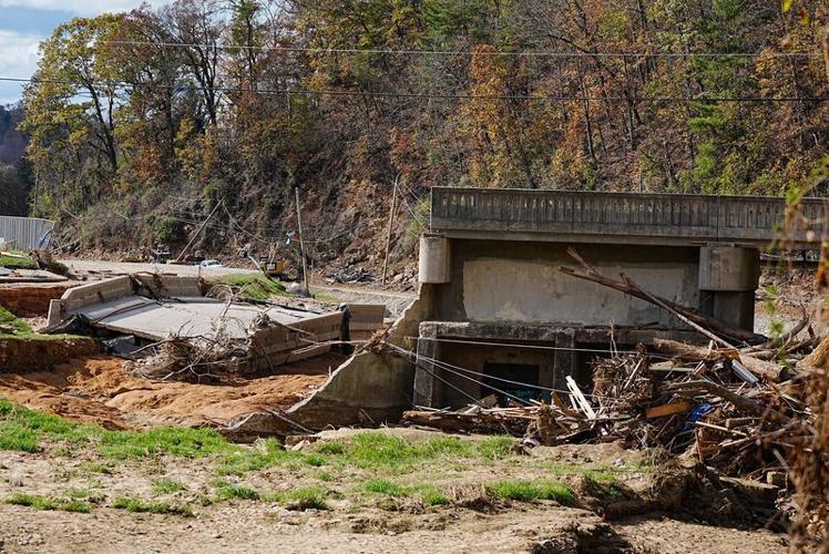 A part of the bridge that collapsed lies near the rest of the bridge that connected vehicles from Azalea Road to Asheville Recreation Park. Destruction is still evident along Swannanoa River in Asheville on Nov. 7, 2024 from Tropical Storm Helene that c...