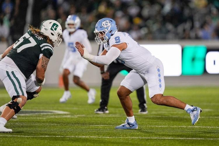 Sep 6, 2025; Charlotte, North Carolina, USA; North Carolina Tar Heels defensive lineman Melkart Abou-Jaoude (9) rushes against Charlotte 49ers offensive lineman Mason Bowers (57) during the first quarter at Jerry Richardson Stadium. Mandatory Credit: Ji...