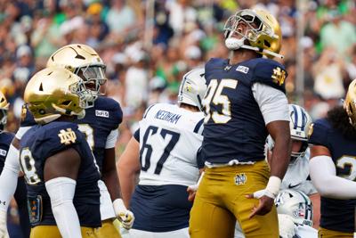 Notre Dame defensive lineman Bryce Young (95) celebrates after getting a stop during a NCAA football game against Rice at Notre Dame Stadium on Saturday, Sept. 12, 2026, in South Bend.