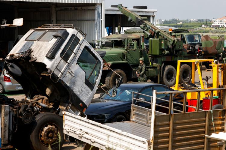 Taiwan military vehicles are parked inside autos workshop owner Ho Chi-hua's vehicle repair workshop during a drill simulating emergency repairs on damaged military vehicles in Penghu