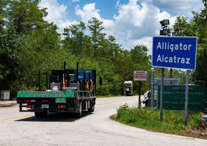 A Guaranteed Fence Corp truck turns into the entrance after Governor Ron DeSantis held a press conference at Alligator Alcatraz