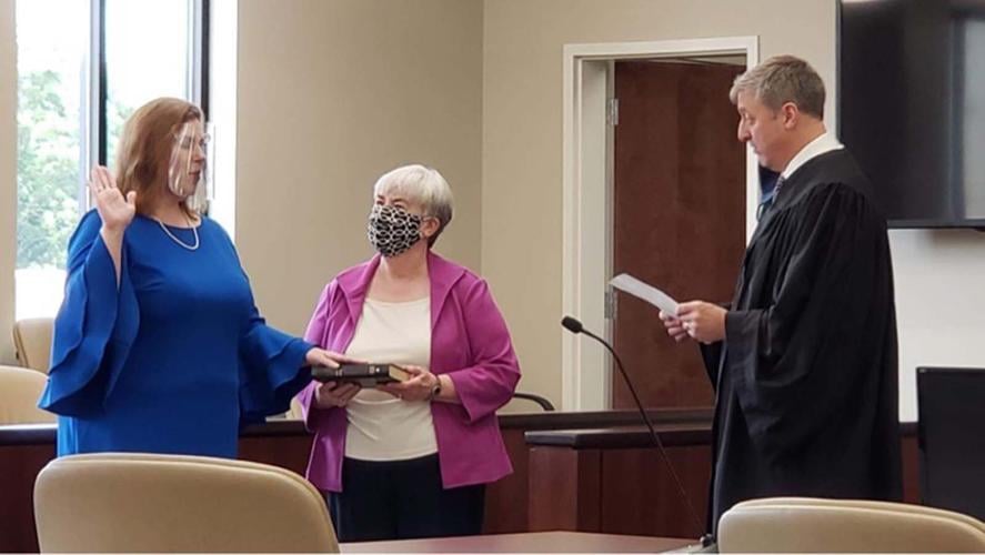 McEntire takes the oath as new District Court judge