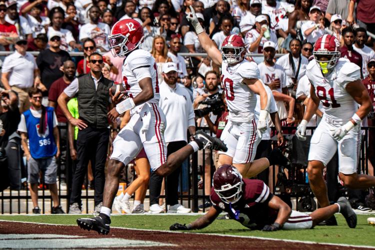 Alabama quarterback Keelon Russell (12) carries the ball for a touchdown during a college football game between Mississippi