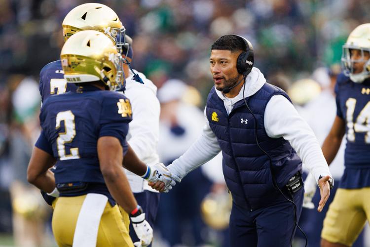 Notre Dame football coach Marcus Freeman celebrates after a touchdown against Syracuse during their game at Notre Dame Stadium on Saturday, Nov. 22, 2025.