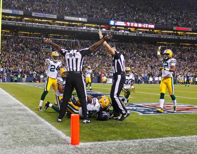 Officials indicate opposite rulings, one a touchdown, one incomplete during the Packers 14-12 loss to the Seattle Seahawks in Seattle, Monday, Sept. 24, 2012.