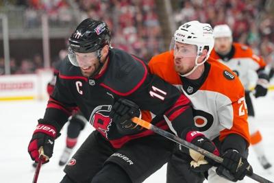 May 4, 2026; Raleigh, North Carolina, USA; Carolina Hurricanes center Jordan Staal (11) and Philadelphia Flyers defenseman Nick Seeler (24) battle during the third period in game two of the second round of the 2026 Stanley Cup Playoffs at Lenovo Center....