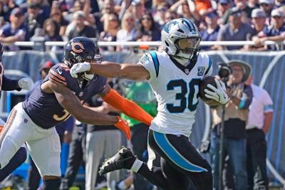 Oct 6, 2024; Chicago, Illinois, USA; Carolina Panthers running back Chuba Hubbard (30) runs for a touchdown against the Chicago Bears during the first half at Soldier Field. Mandatory Credit: David Banks-Imagn Images