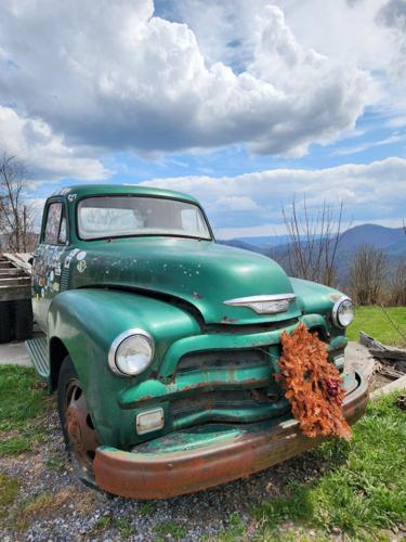 A rustic vehicle stands ready at Big Walker Lookout for visitors to photograph between snacks and musical performances.