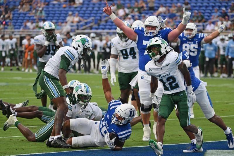 Sep 5, 2026; Durham, North Carolina, USA;  Duke Blue Devils running back Nate Sheppard (20) scores the first touchdown of the game during the first quarter against the Tulane Green Wave at Wallace Wade Stadium.  Mandatory Credit: Zachary Taft-Imagn Images